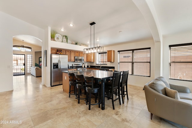 dining area with lofted ceiling and sink