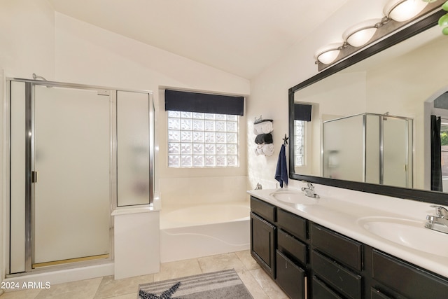 bathroom featuring vanity, independent shower and bath, lofted ceiling, and tile patterned flooring