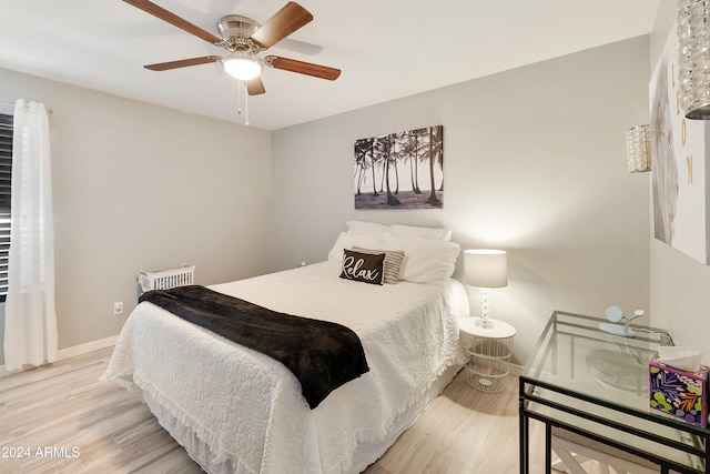 bedroom featuring light wood-type flooring and ceiling fan