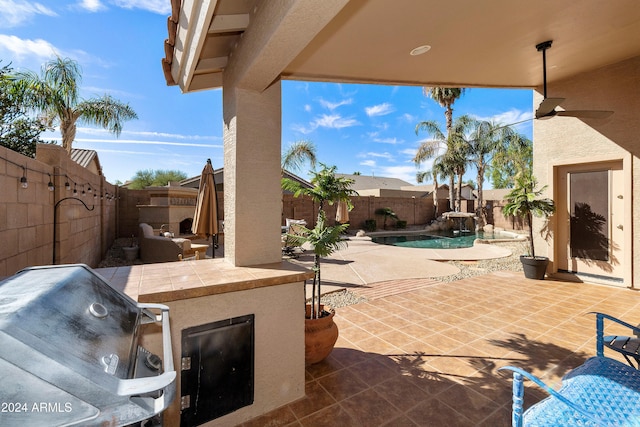 view of patio / terrace featuring a fenced in pool, area for grilling, and ceiling fan