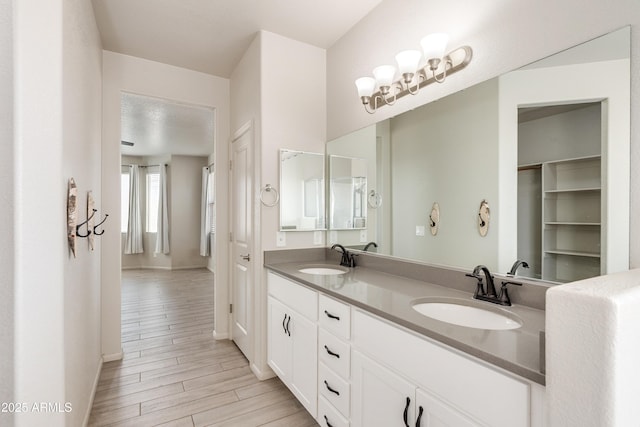 bathroom featuring vanity and hardwood / wood-style floors