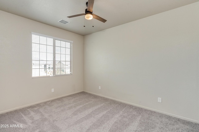 empty room featuring light carpet and ceiling fan