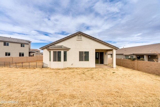 rear view of property featuring a patio