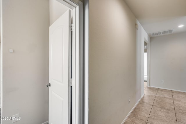 hallway with light tile patterned floors