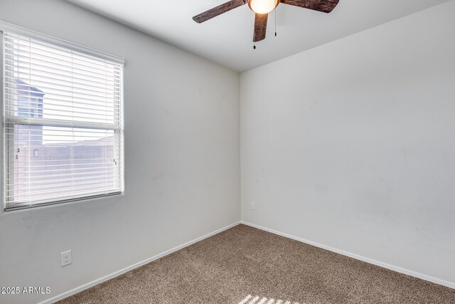 carpeted empty room with ceiling fan