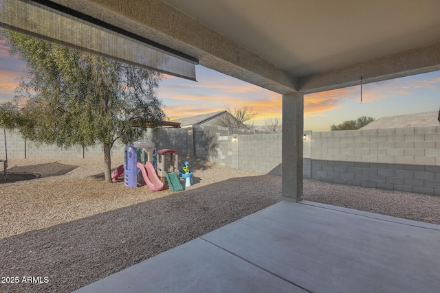 patio terrace at dusk with a playground