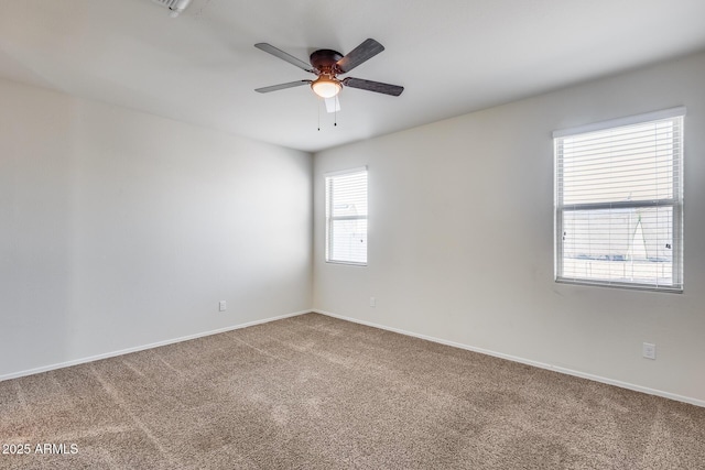 carpeted empty room featuring ceiling fan