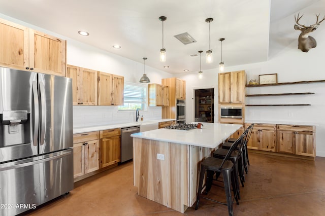 kitchen with a kitchen island, appliances with stainless steel finishes, concrete floors, and hanging light fixtures