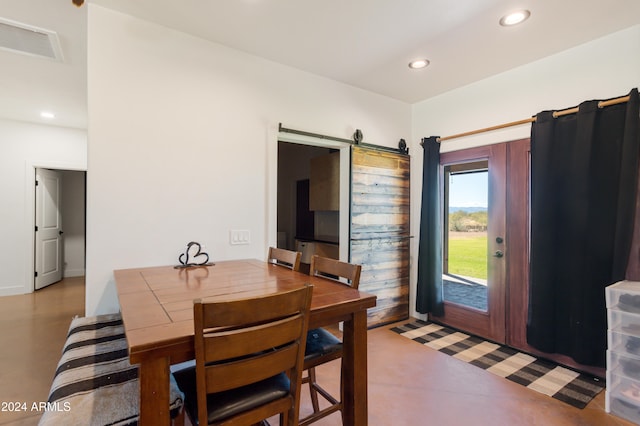 dining room with a barn door