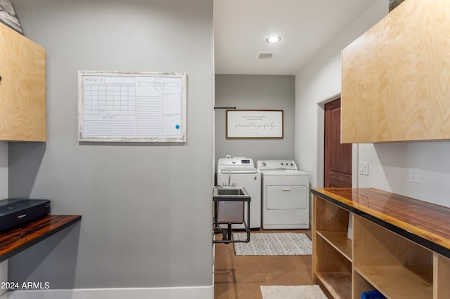 washroom featuring sink and washer and dryer