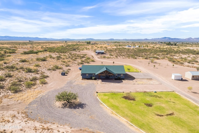 birds eye view of property with a mountain view