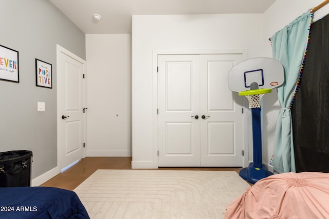 bedroom featuring a closet and hardwood / wood-style flooring