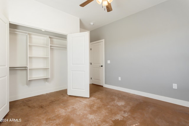 unfurnished bedroom with ceiling fan, a closet, and lofted ceiling