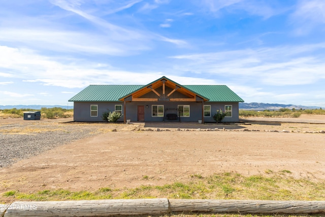 view of front of home featuring a mountain view