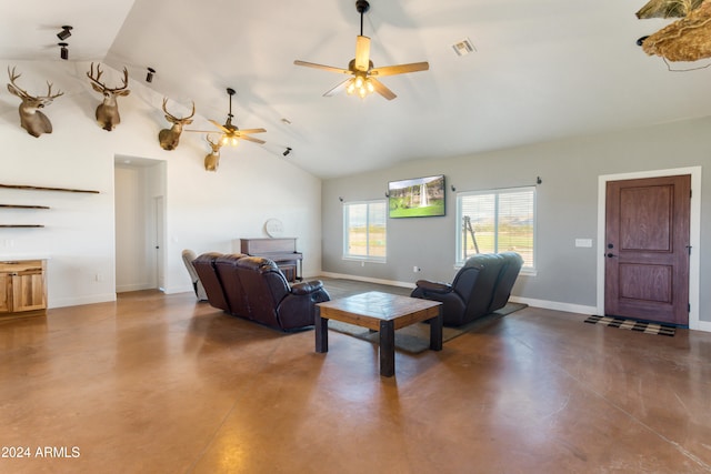 living room with lofted ceiling, ceiling fan, and a fireplace