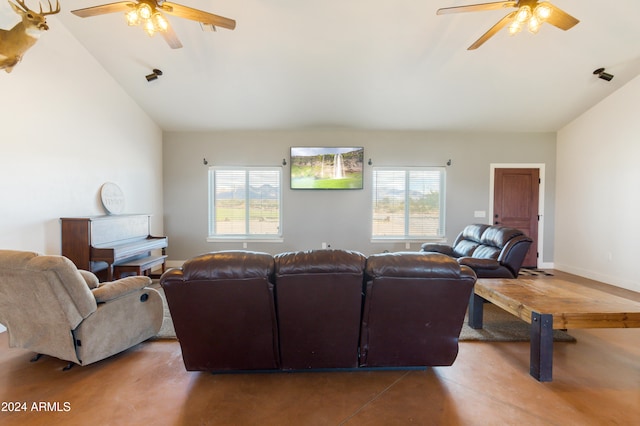 living room featuring a wealth of natural light, ceiling fan, and lofted ceiling