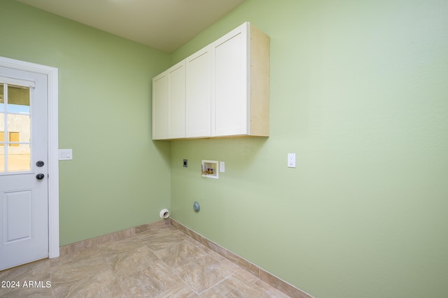 laundry area featuring cabinet space, electric dryer hookup, baseboards, and washer hookup