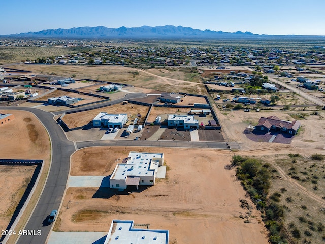 birds eye view of property with a mountain view