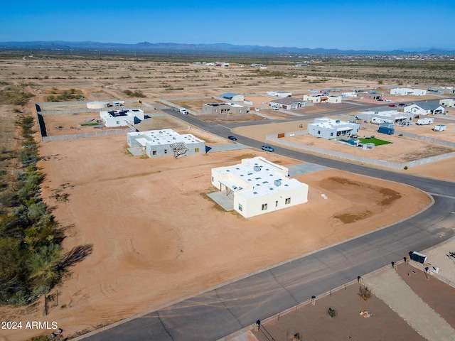 bird's eye view with a desert view and a mountain view
