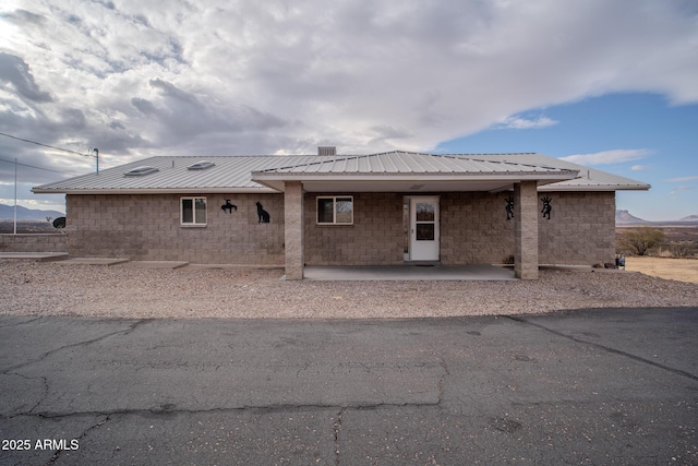 rear view of property with a mountain view