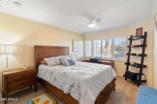 bedroom featuring ornamental molding and ceiling fan