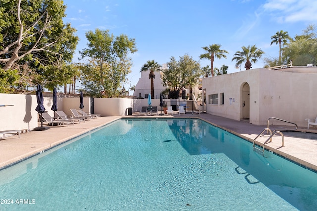 view of swimming pool with a patio