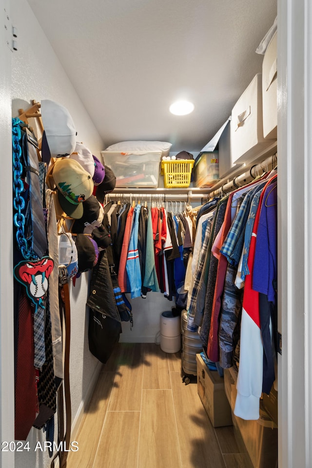 walk in closet featuring light hardwood / wood-style floors