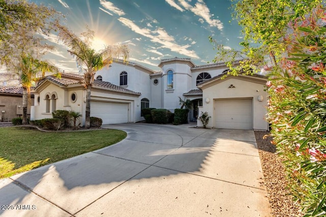 4497 E Carriage Way, Gilbert, AZ 85297 - mediterranean / spanish house featuring concrete driveway, an attached garage, stucco siding, a front lawn, and a tiled roof