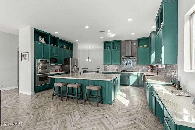 4497 E Carriage Way, Gilbert, AZ 85297 - kitchen with wall chimney range hood, appliances with stainless steel finishes, open shelves, green cabinetry, and a sink