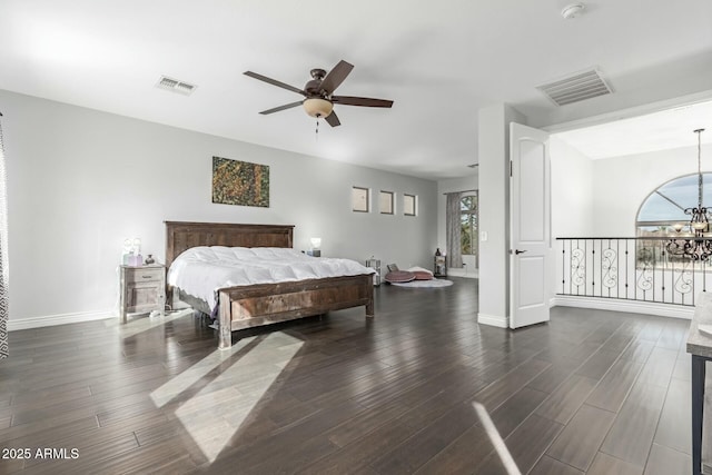 4497 E Carriage Way, Gilbert, AZ 85297 - bedroom with dark wood-type flooring, baseboards, a chandelier, and ceiling fan