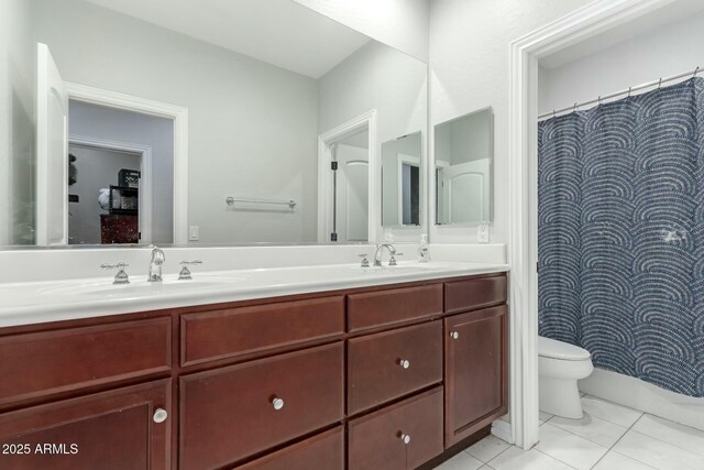4497 E Carriage Way, Gilbert, AZ 85297 - bathroom featuring double vanity, toilet, tile patterned flooring, and a shower with shower curtain