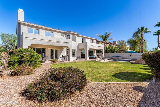 4497 E Carriage Way, Gilbert, AZ 85297 - rear view of property with a balcony, stucco siding, a patio area, and a chimney