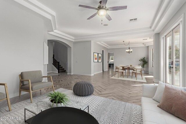 4497 E Carriage Way, Gilbert, AZ 85297 - living area with arched walkways, baseboards, stairs, ceiling fan, and a chandelier