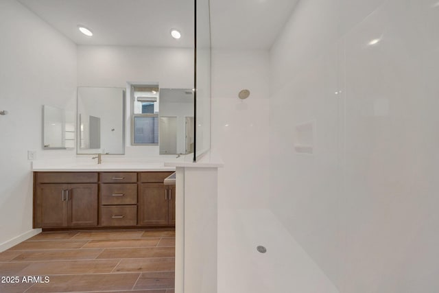 bathroom featuring vanity and walk in shower