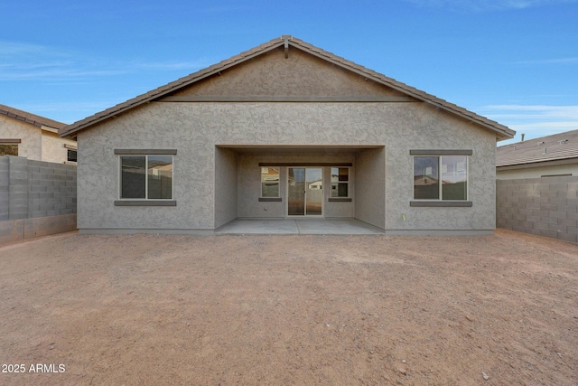 rear view of property with a patio area