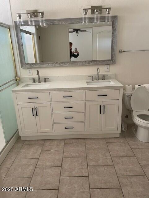 bathroom featuring a sink, tile patterned floors, and double vanity