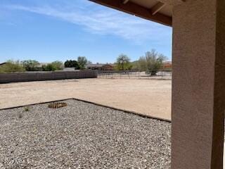 view of yard with fence and an enclosed area