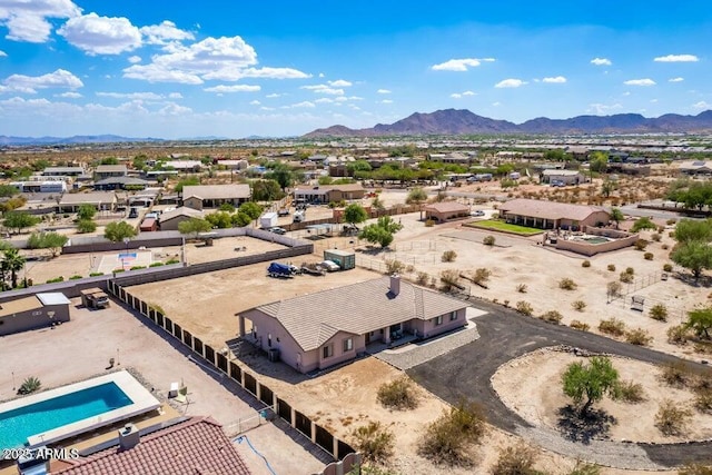 birds eye view of property with a mountain view