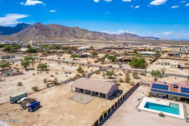 birds eye view of property with view of desert and a mountain view