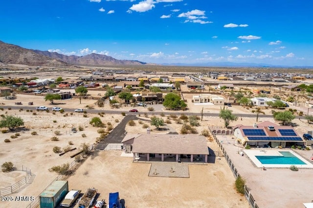 birds eye view of property with a mountain view