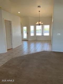 unfurnished room with recessed lighting, tile patterned floors, and a chandelier