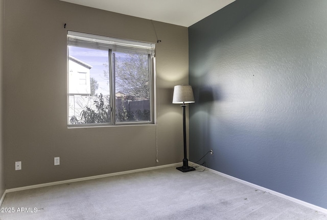 carpeted spare room with a wealth of natural light