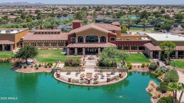 drone / aerial view featuring a water view and a residential view