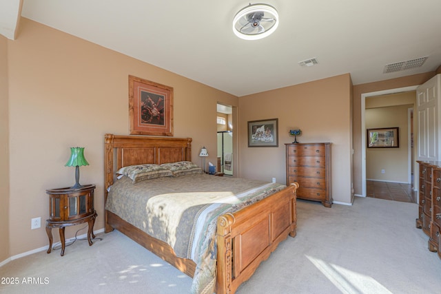 bedroom with light colored carpet