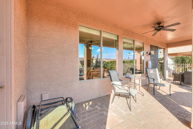 view of patio / terrace featuring ceiling fan