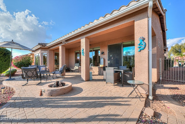 view of patio with a fire pit