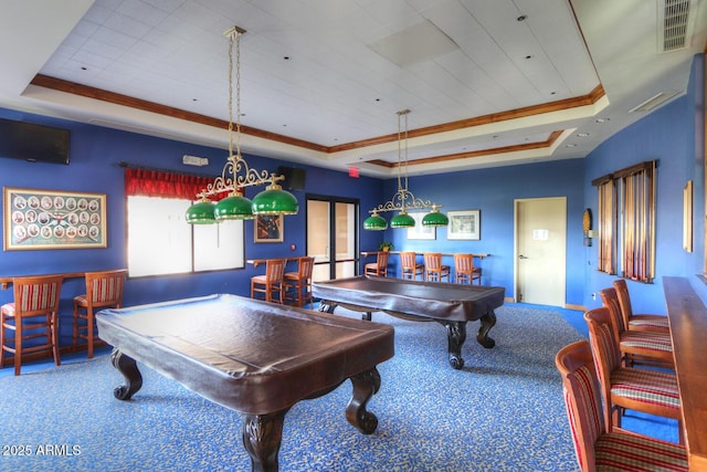 playroom featuring pool table, ornamental molding, a tray ceiling, and carpet