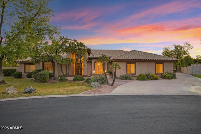 9 E Los Arboles Cir, Tempe, AZ 85284 - view of front of home with concrete driveway, stucco siding, and a tiled roof