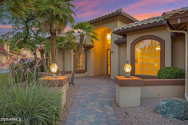 9 E Los Arboles Cir, Tempe, AZ 85284 - view of front facade featuring stucco siding, a tiled roof, and a patio area