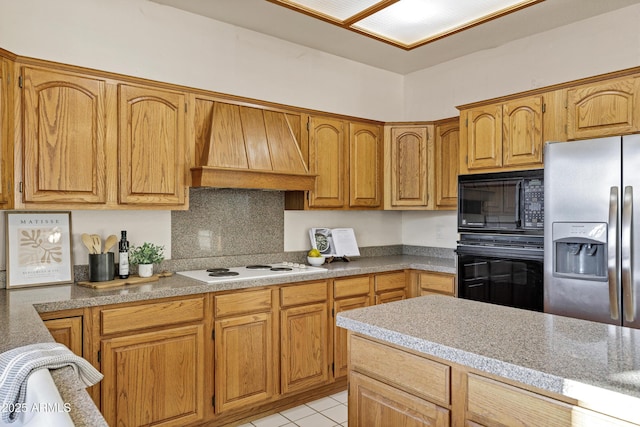 9 E Los Arboles Cir, Tempe, AZ 85284 - kitchen with black appliances, premium range hood, decorative backsplash, light tile patterned floors, and light countertops